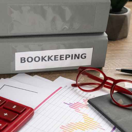 Bookkeeper's Workplace with Folders and Documents on Table